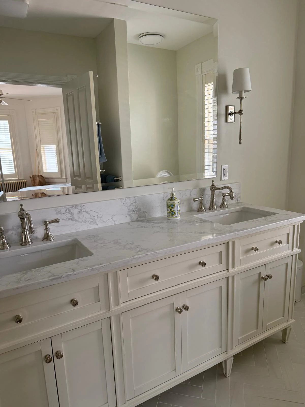 Professionally cleaned double bathroom vanity with polished faucets and mirrors