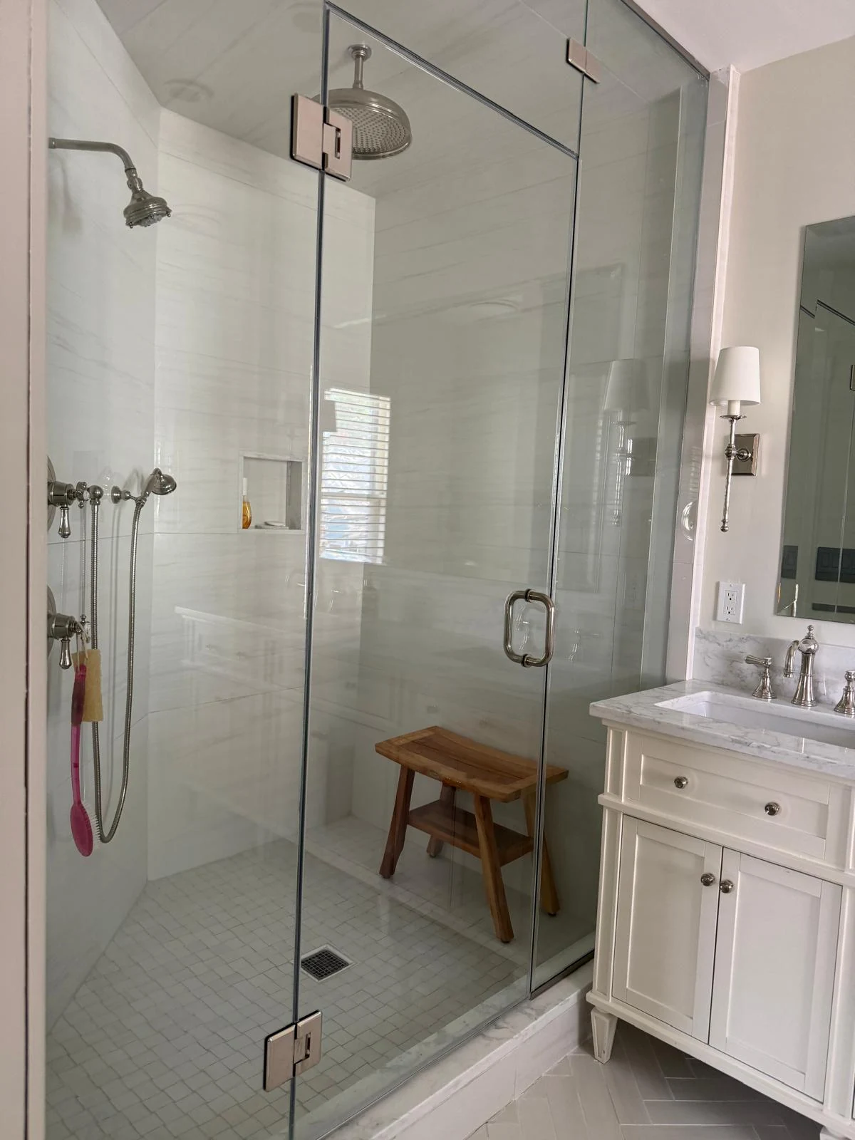 Detailed view of a professionally cleaned glass shower and tiled interior