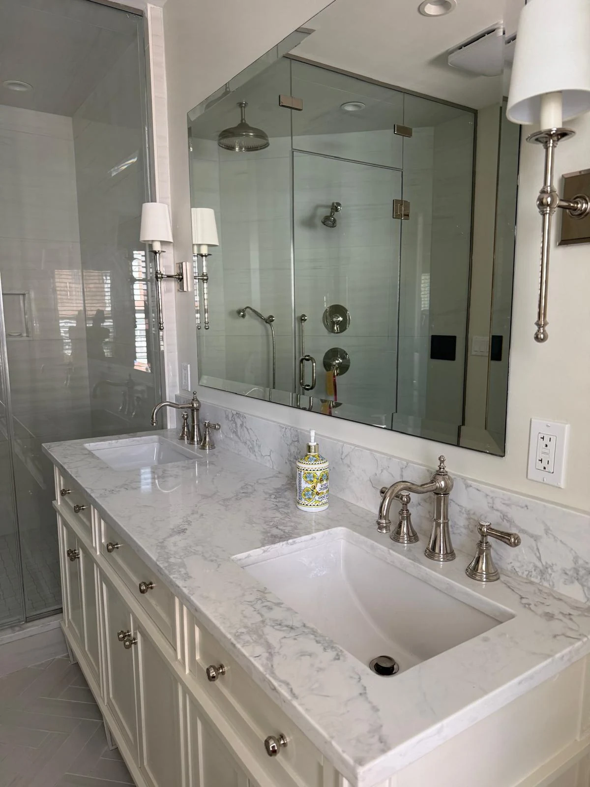 Professionally cleaned bathroom vanity with polished sink, faucet, counter, and mirror